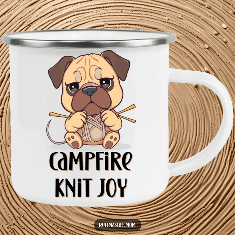 Funny Bullmastiff camping mug showing a determined dog attempting to knit with yarn and needles outdoors.