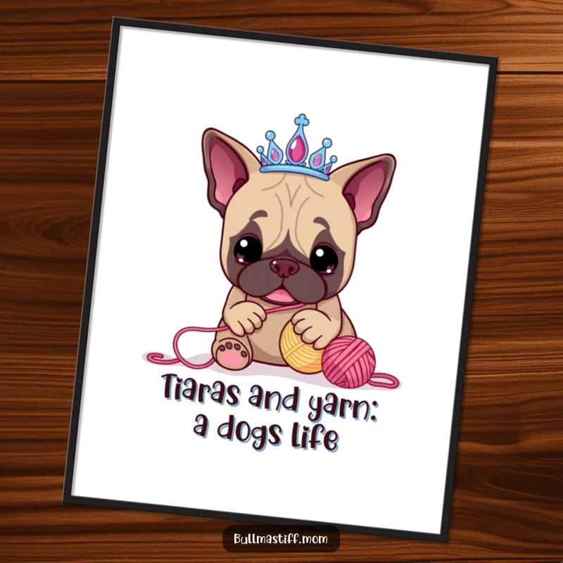 Funny Free Printable Wall Art: A Bullmastiff wearing a tiara playfully batting at a yarn ball, creating whimsical decor.
