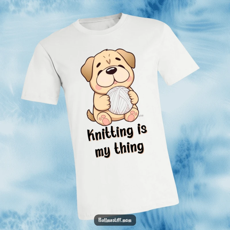 Funny Bullmastiff dog with a gentle smile, holding a fluffy yarn ball, perfect for craft enthusiasts.